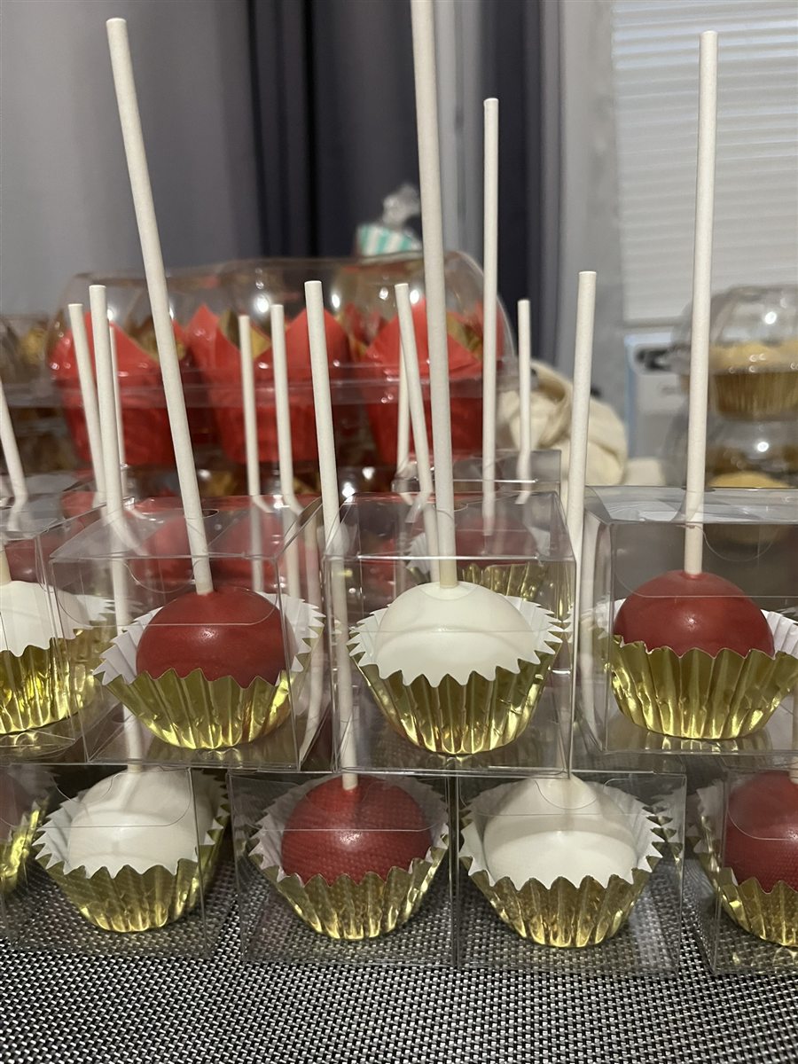 Red and white celebration cake pops